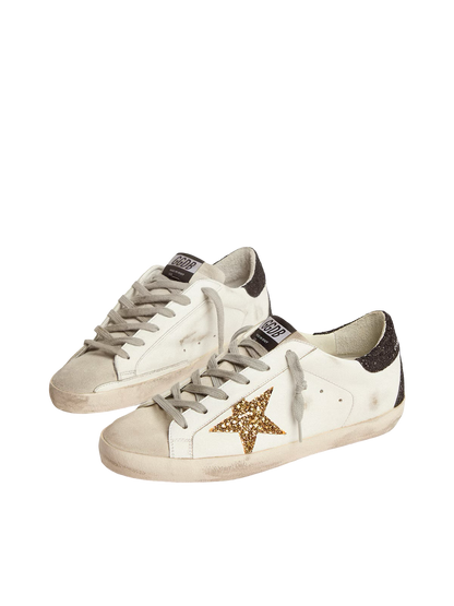 Golden goose Women’s Super-Star in nappa leather with gold glitter star and black glitter heel tab