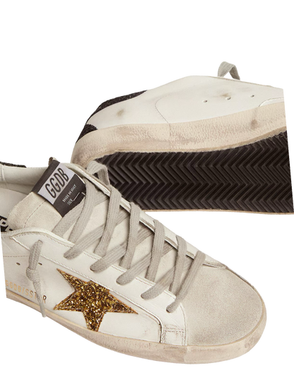 Golden goose Women’s Super-Star in nappa leather with gold glitter star and black glitter heel tab
