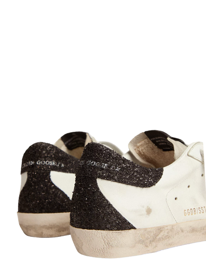 Golden goose Women’s Super-Star in nappa leather with gold glitter star and black glitter heel tab
